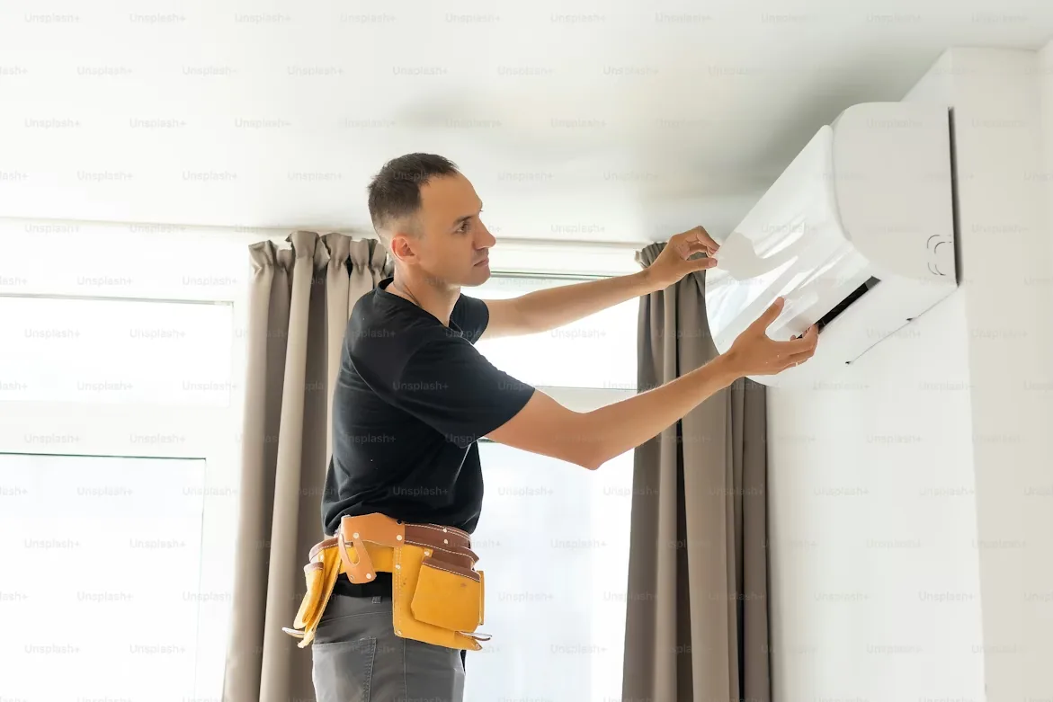 Certified HVAC engineer performing precision AC installation in Sindhudurg